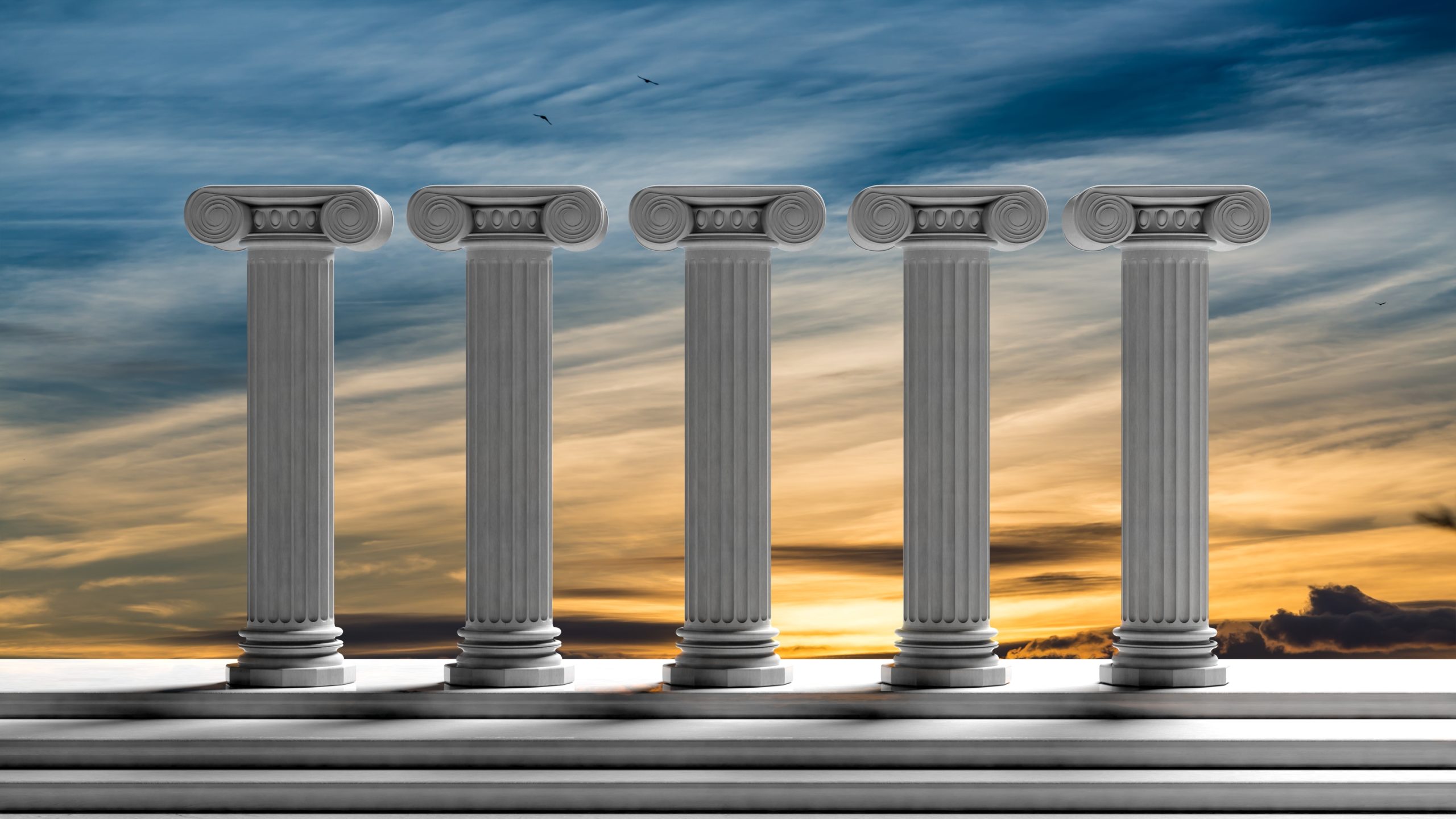 Five,Ancient,Pillars,With,Sunset,Sky,Background.