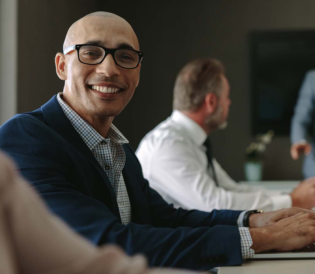 Smiling,Businessman,During,A,Meeting,In,Conference,Room.,Male,Executive